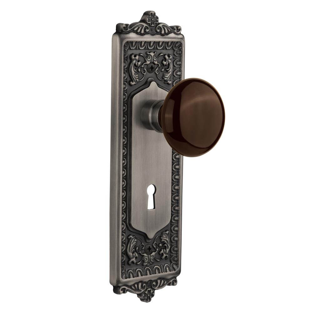 Nostalgic Warehouse EADBRN Passage Knob Egg and Dart Plate with Brown Porcelain Knob with Keyhole in Antique Pewter